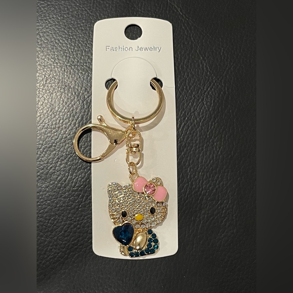 Hello Kitty Gold Keychain with Pink Bow and Blue Heart